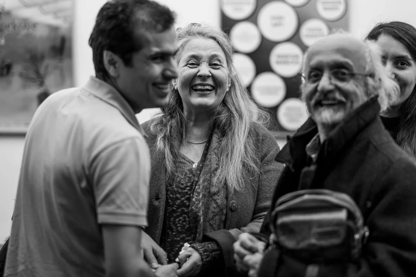 Three guests laughing together