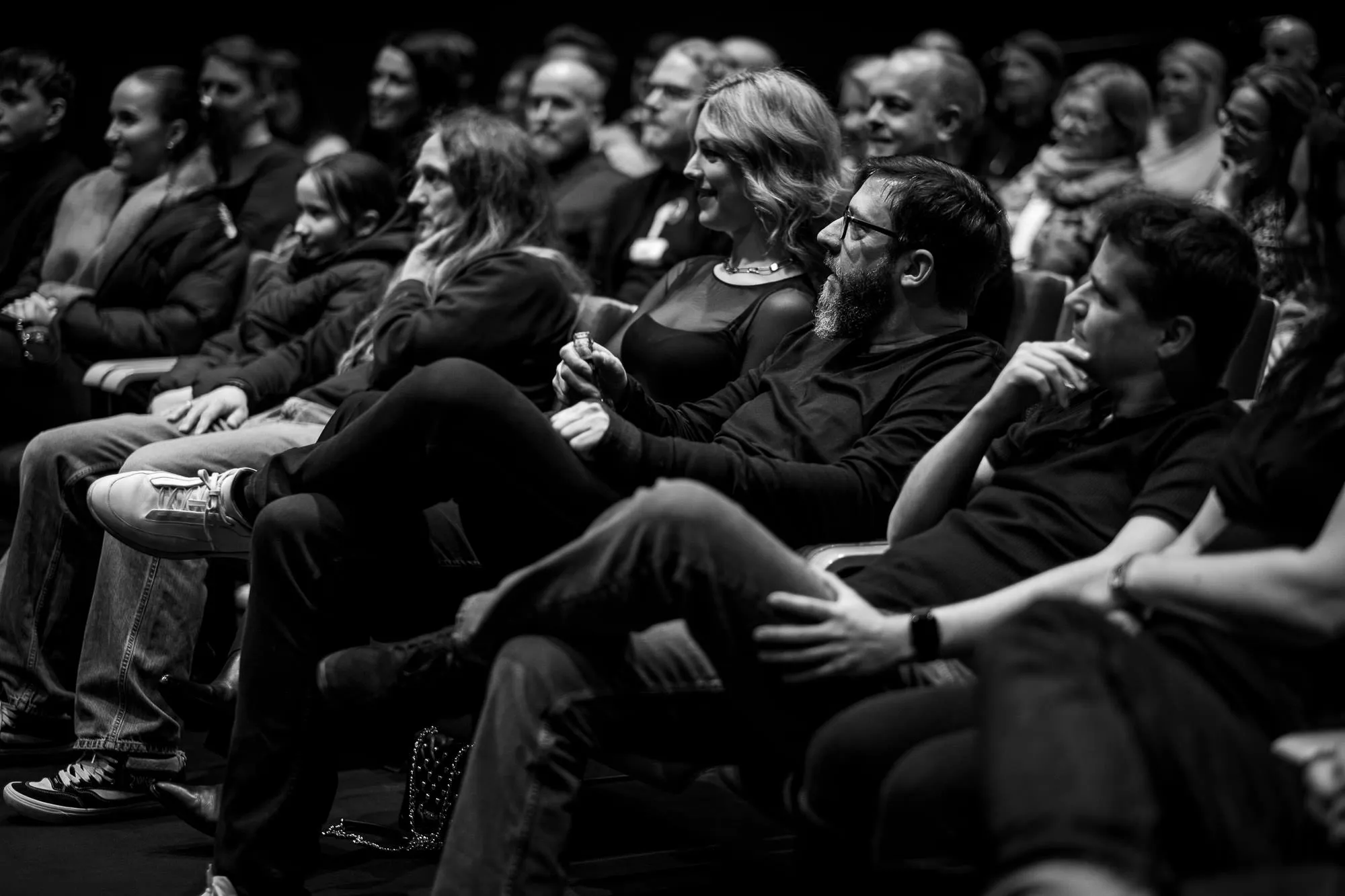 Audience laughing in their seats