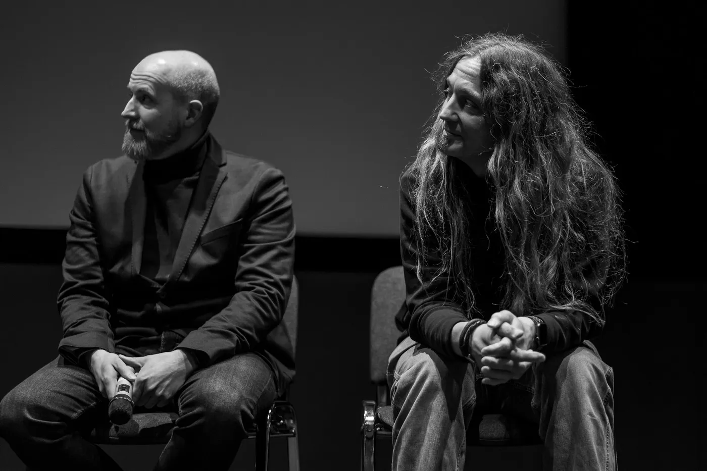 Two panel guests on stage during the Q&A